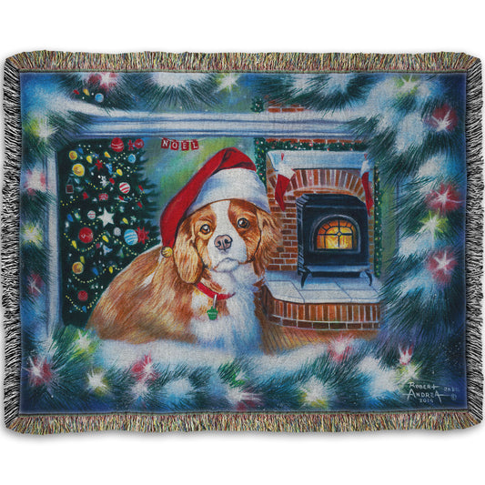 A woven throw blanket depicting a little dog with a red santa hat, sitting inside near a fireplace.