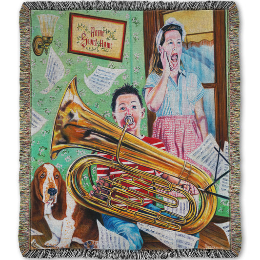 A woven throw blanket designed with a painting of a child playing tuba loudly, to the displeasure of his mother, as sheet music flies through the air.