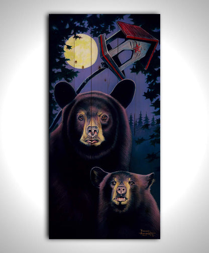 A painting of a mother bear and her cub standing under the moon. They have playfully scratched up a small birdhouse behind them. Printed on a wood pallet.