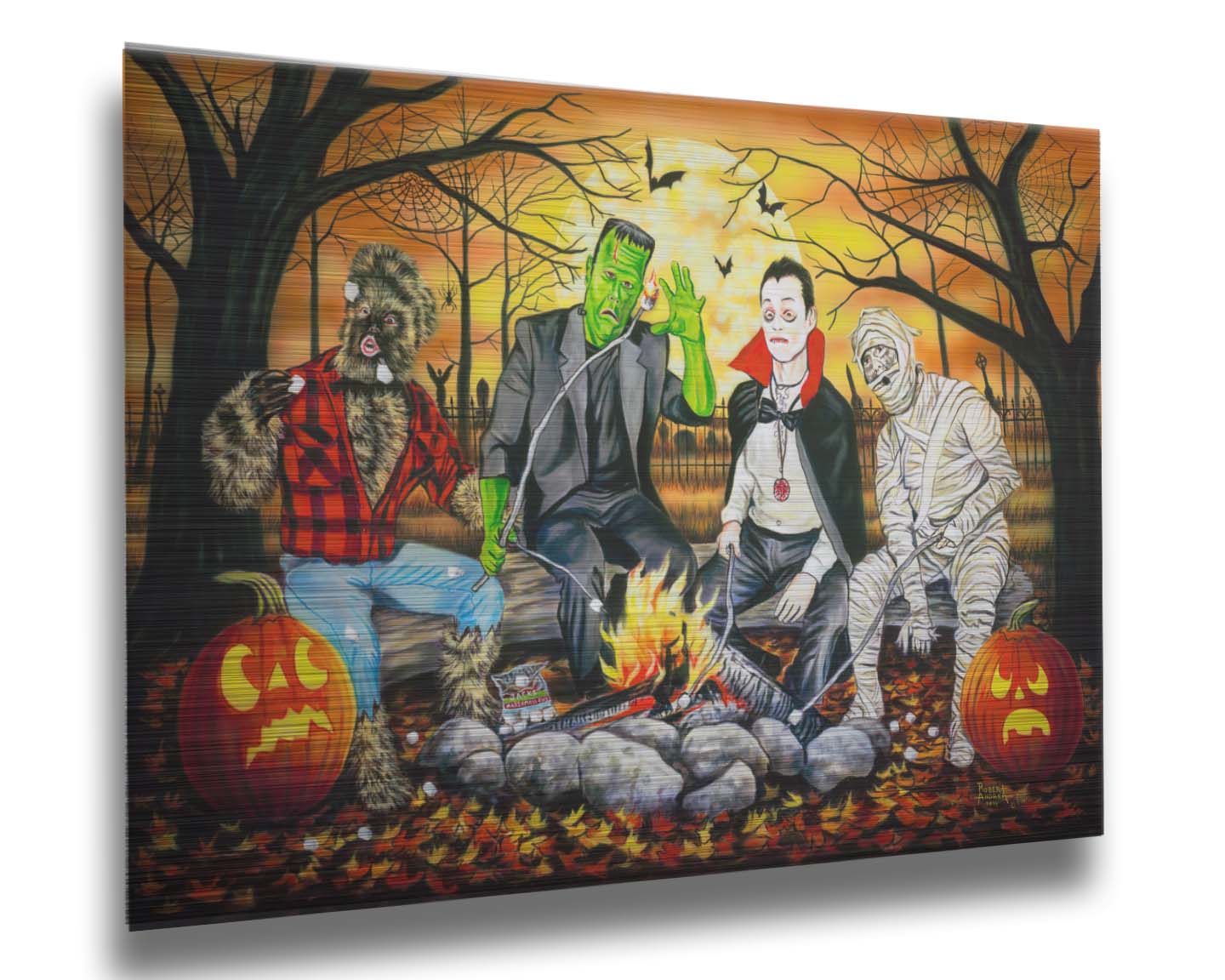 A painting of the wolfman, Frankenstein's monster, Dracula, and a mummy sitting around a campfire, roasting marshmallows. The fall leaves cover the ground, and there is a cemetery in the background. Printed on metal.