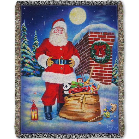 Festive blanket with a Santa Claus design. He stands on a snowy rooftop at night with a bag of toys.
