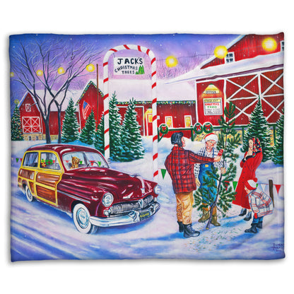 Coral fleece blanket detailed with a painting of a family at a farm, buying a christmas tree.