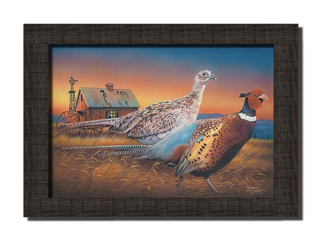 A painting of two pheasants, walking through golden grasses against a colorful sunset. Printed on canvas and framed.