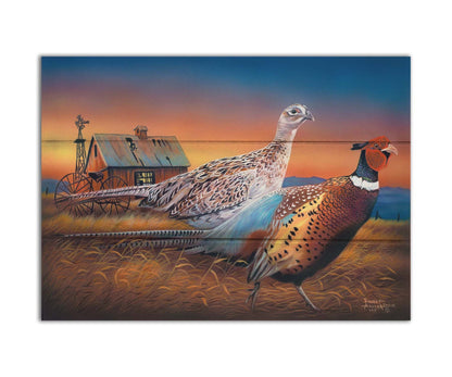 A painting of two pheasants, walking through golden grasses against a colorful sunset. Printed on a box board.