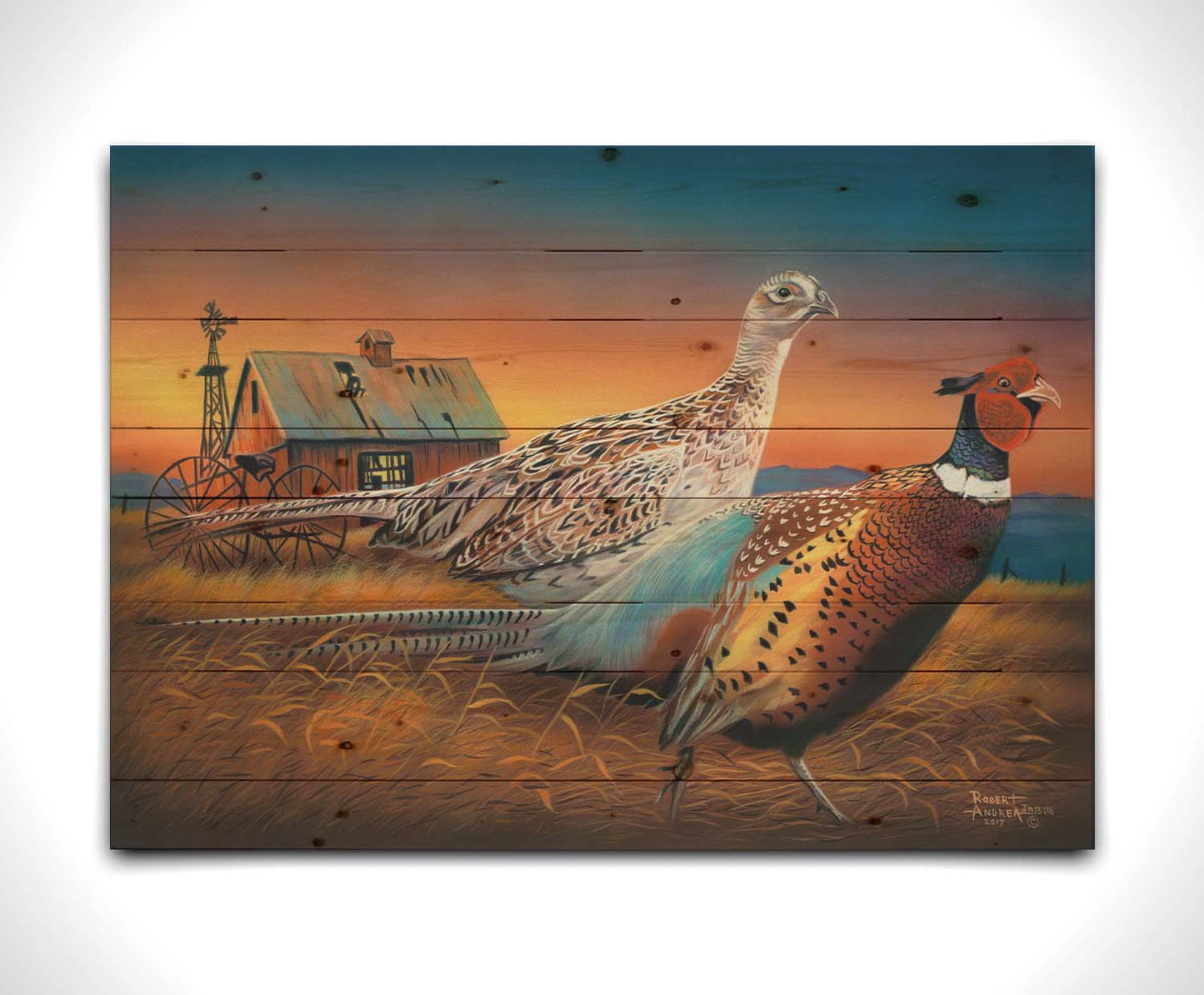 A painting of two pheasants, walking through golden grasses against a colorful sunset. Printed on a wood pallet.