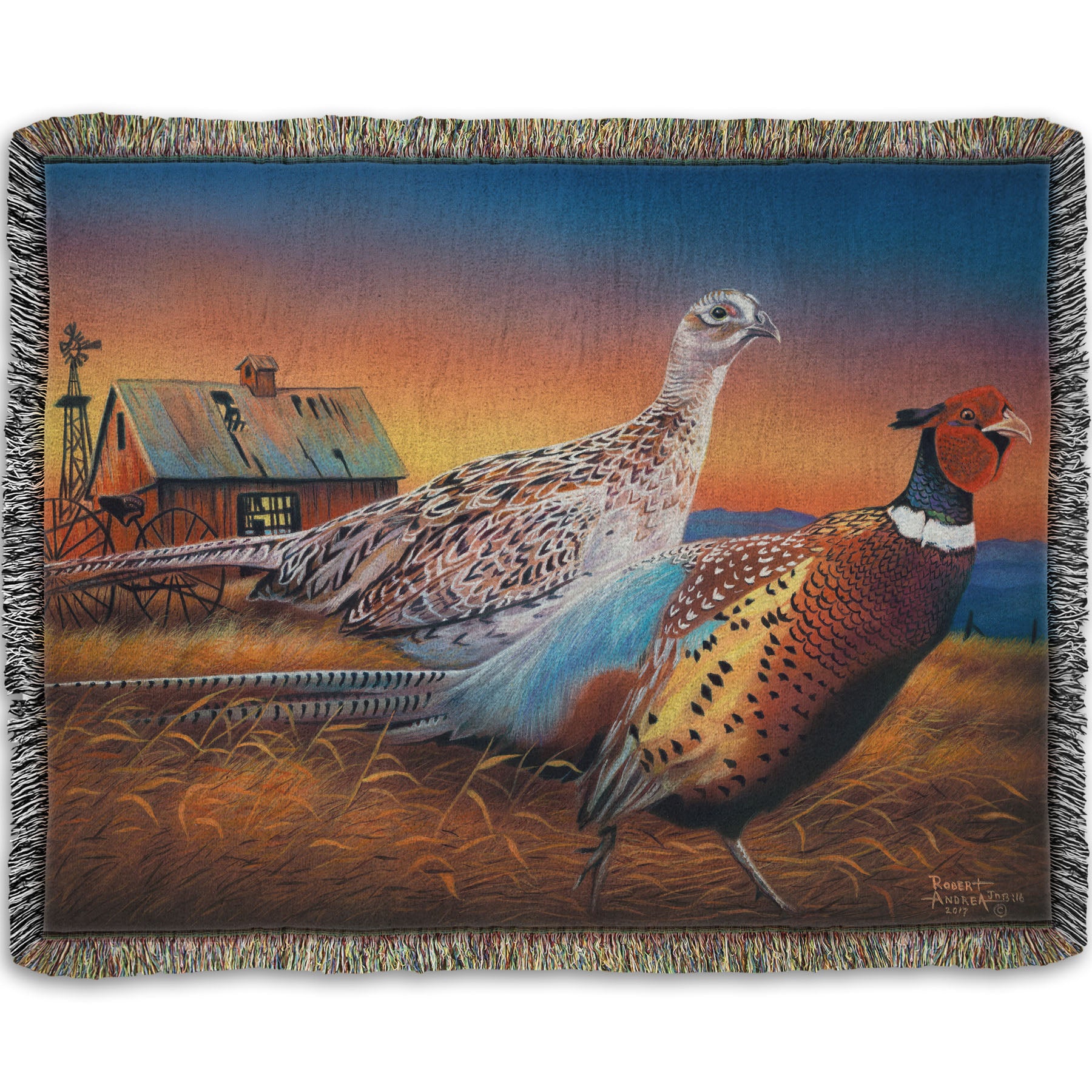Woven throw blanket designed with a painting of two pheasants, walking through golden grasses against a colorful sunset.