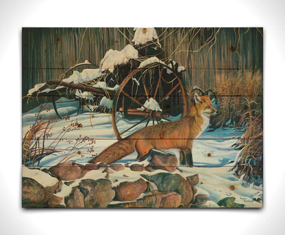 A painting of a red fox in the winter snow. It is standing by some old farming equipment, grasses, and stones. Printed on a wood pallet.