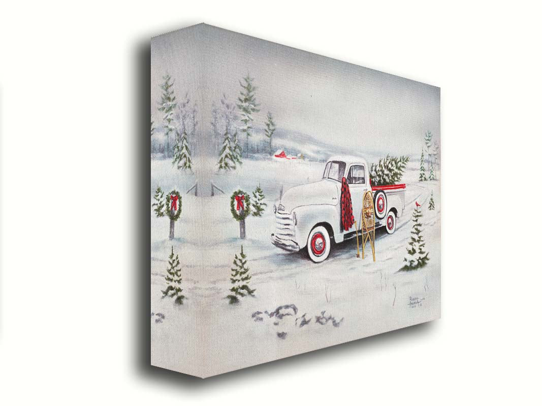 A painting of a vintage white truck in the snow, carrying a snow-covered evergreen tree. Printed on canvas.