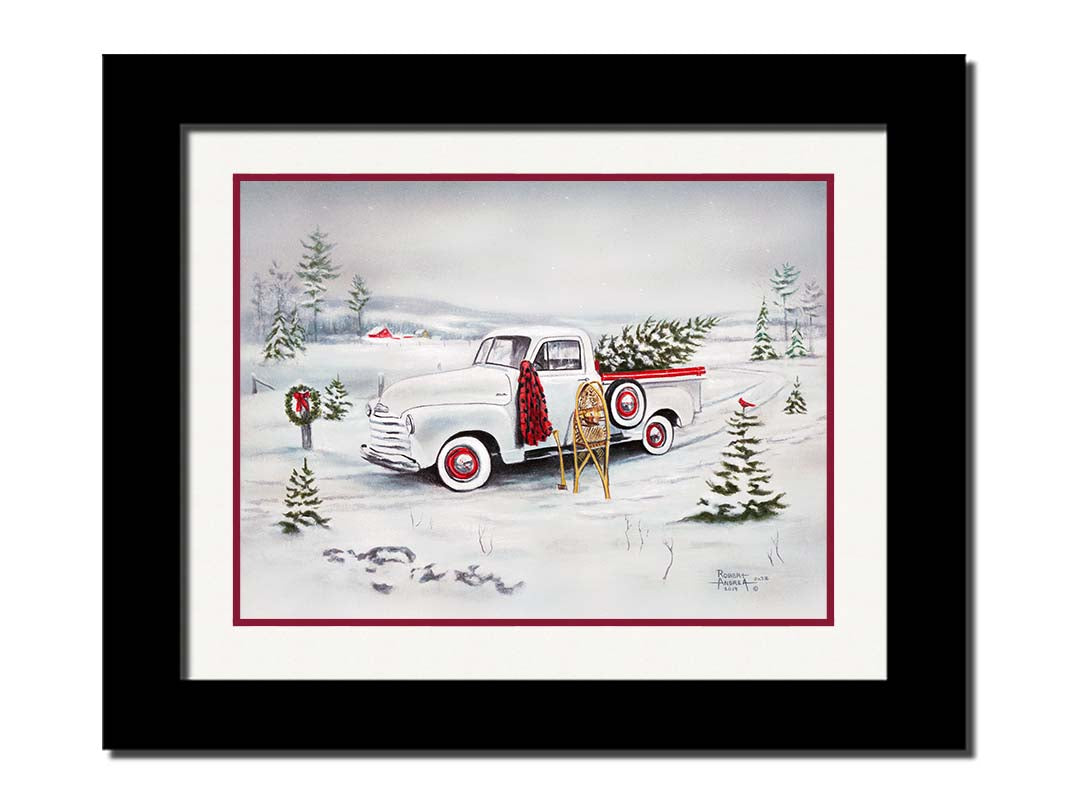 A painting of a vintage white truck in the snow, carrying a snow-covered evergreen tree. Printed on paper, matted, and framed.