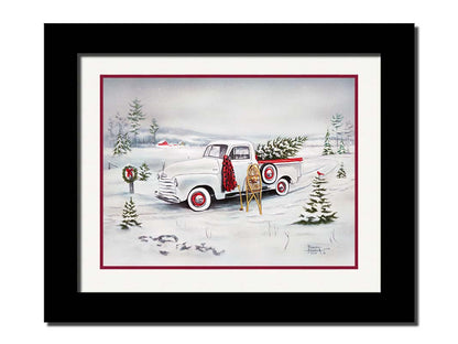 A painting of a vintage white truck in the snow, carrying a snow-covered evergreen tree. Printed on paper, matted, and framed.