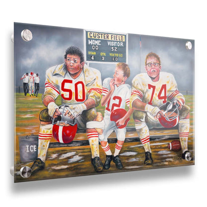 A painting of some young football players, losing their game. Only the smallest among them is in good condition to go out on the field in place of the larger players, who are injured. Printed on acrylic.