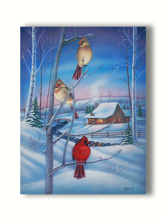 A painting of three cardinals, perched on branches above the snow. A cabin can be seen in the background, warm and inviting. Printed on canvas.