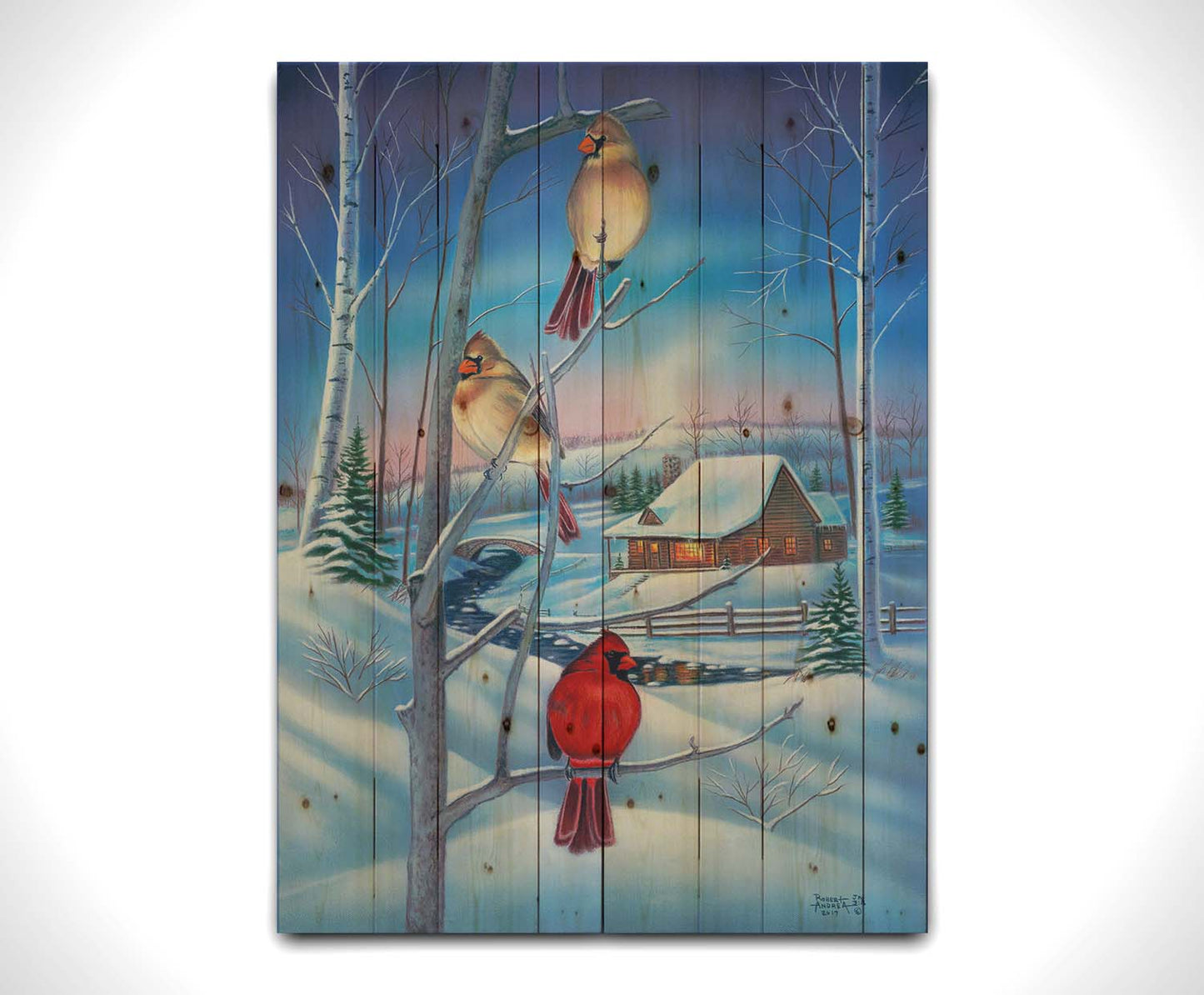 A painting of three cardinals, perched on branches above the snow. A cabin can be seen in the background, warm and inviting. Printed on a wood pallet.