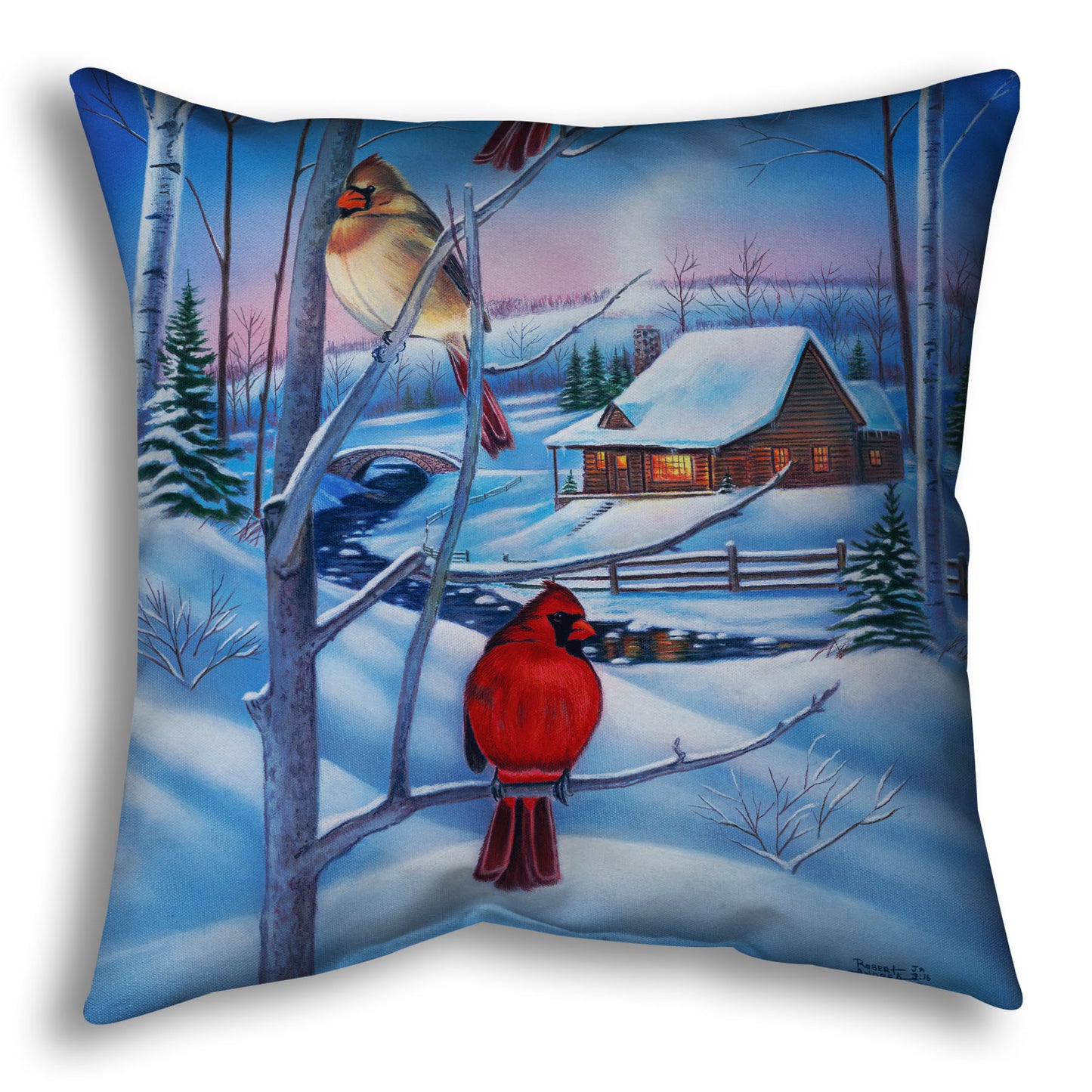 Decorative pillow designed with a snowy winter scene, focused on cardinals near a cabin.