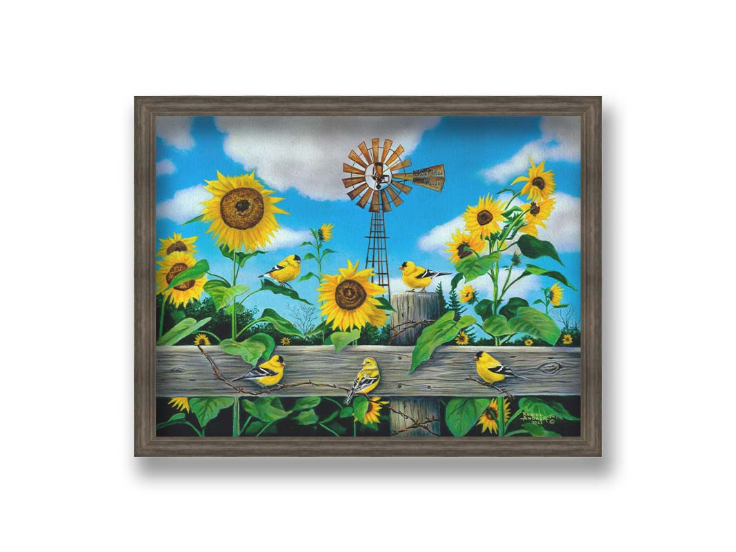 A painting of a field of sunflowers and yellow American Goldfinches, also known as chickadees. The sky is a vibrant blue, and a windmill sits in the background. Printed on canvas and framed.