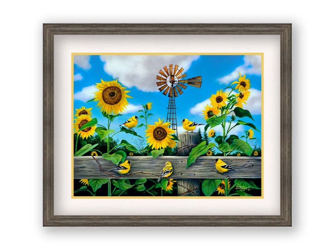 A painting of a field of sunflowers and yellow American Goldfinches, also known as chickadees. The sky is a vibrant blue, and a windmill sits in the background. Printed on paper, matted, and framed.