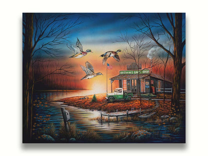 A painting of three ducks flying over the water, in front of a bait shop at sunset. Printed on a canvas.