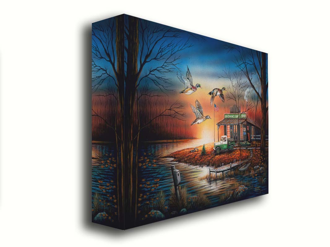 A painting of three ducks flying over the water, in front of a bait shop at sunset. Printed on canvas.