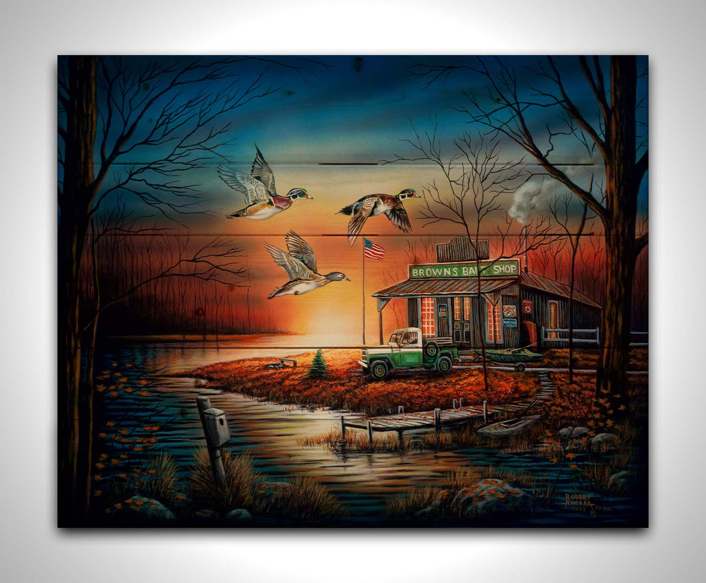 A painting of three ducks flying over the water, in front of a bait shop at sunset. Printed on a wood pallet.