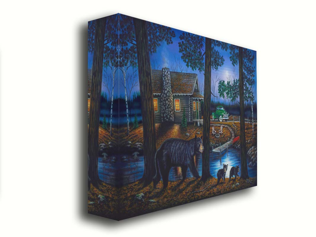 A painting of a mother bear and her two children walking through the woods. There is a cabin in thre background, its windows emitting a gentle warm light in the night. Printed on canvas.