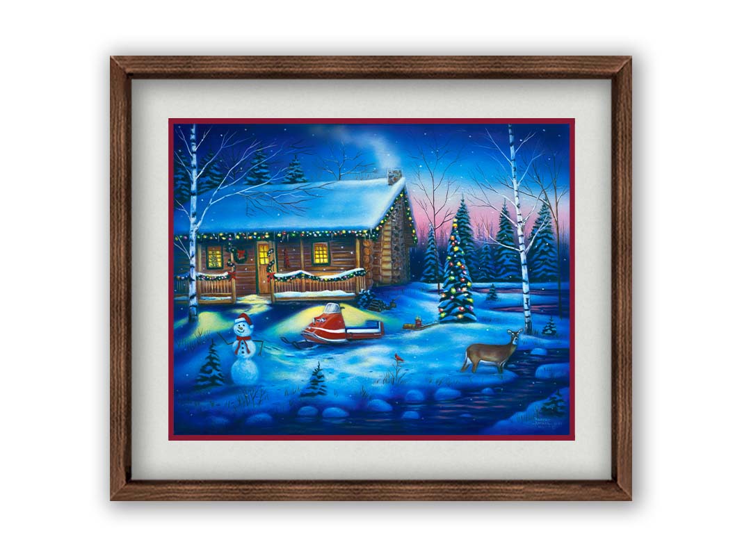 A painting of a snowy cabin decorated with Christmas lights. A deer treks through the snow in the yard, past a snowman to a stream. Printed on paper, matted, and framed.