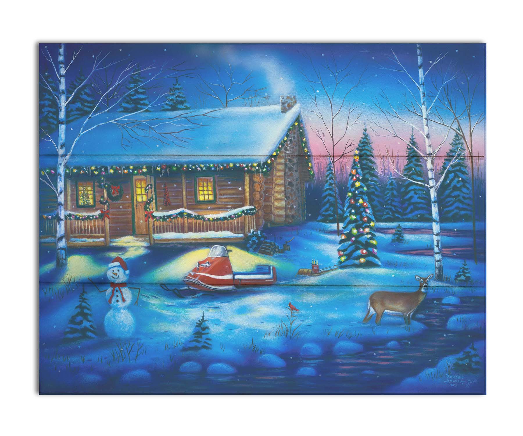 A painting of a snowy cabin decorated with Christmas lights. A deer treks through the snow in the yard, past a snowman to a stream. Printed on a box board.