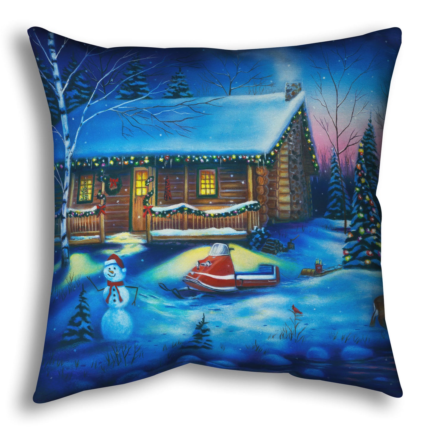 A festive throw pillow decorated with the painting of a snowy cabin decorated with Christmas lights.