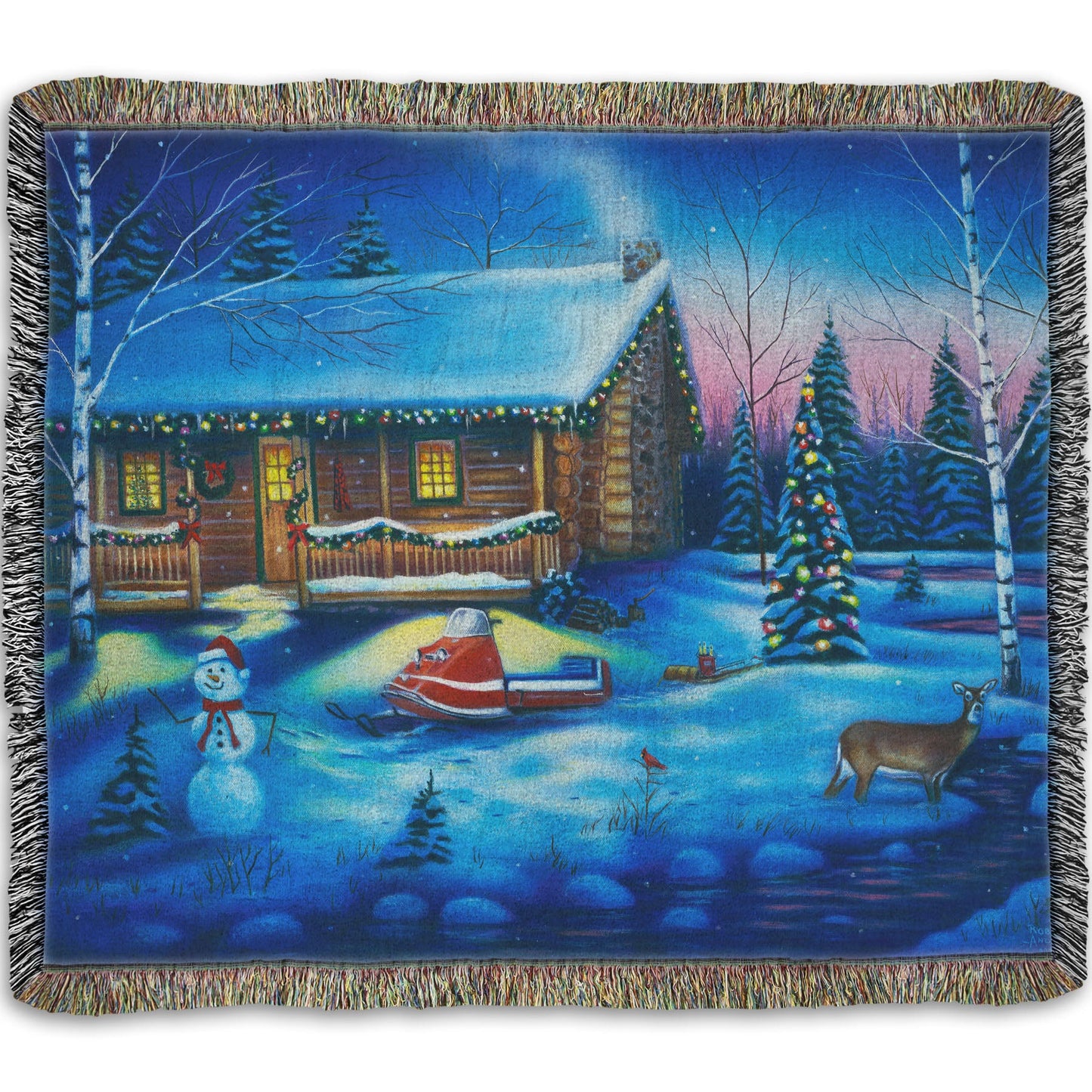 A festive woven throw blanket decorated with the painting of a snowy cabin decorated with Christmas lights.