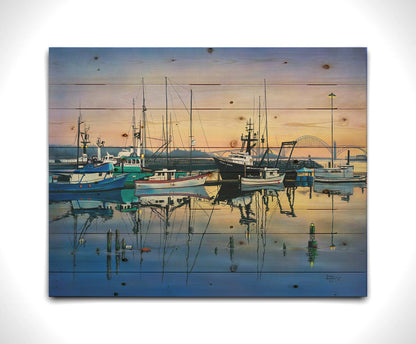 A painting of a harbor with boats docked peacefully by the ocean. Printed on a wood pallet.