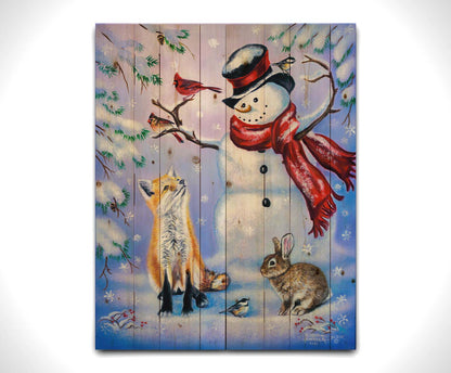 A painting of a snowman, a fox, a rabbit, and a few birds all gathered together, sitting in the snow. Printed on a wood pallet.