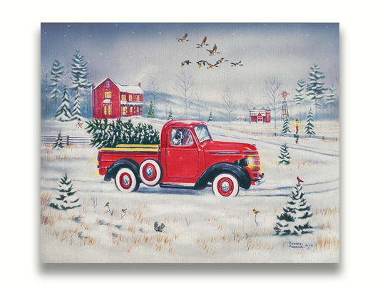 A painting of a vintage red truck, carrying a freshly cut evergreen tree. It is driving toward some red homes in the distance. Geese fly overhead, and birds and squirrels est on the ground near the road. Printed on canvas.