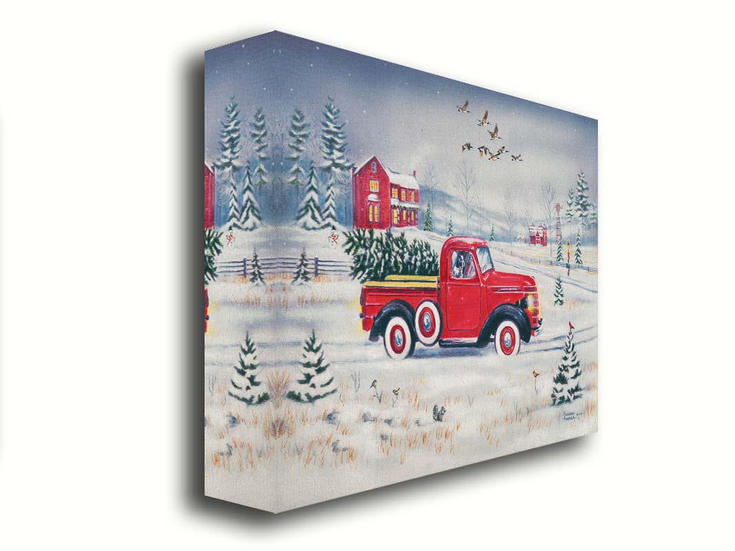 A painting of a vintage red truck, carrying a freshly cut evergreen tree. It is driving toward some red homes in the distance. Geese fly overhead, and birds and squirrels est on the ground near the road. Printed on canvas.