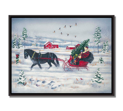 A painting of two people riding a horse-drawn sleigh through the snow, transporting an evergreen tree and gifts, as geese fly overhead. Printed on canvas in a float frame.