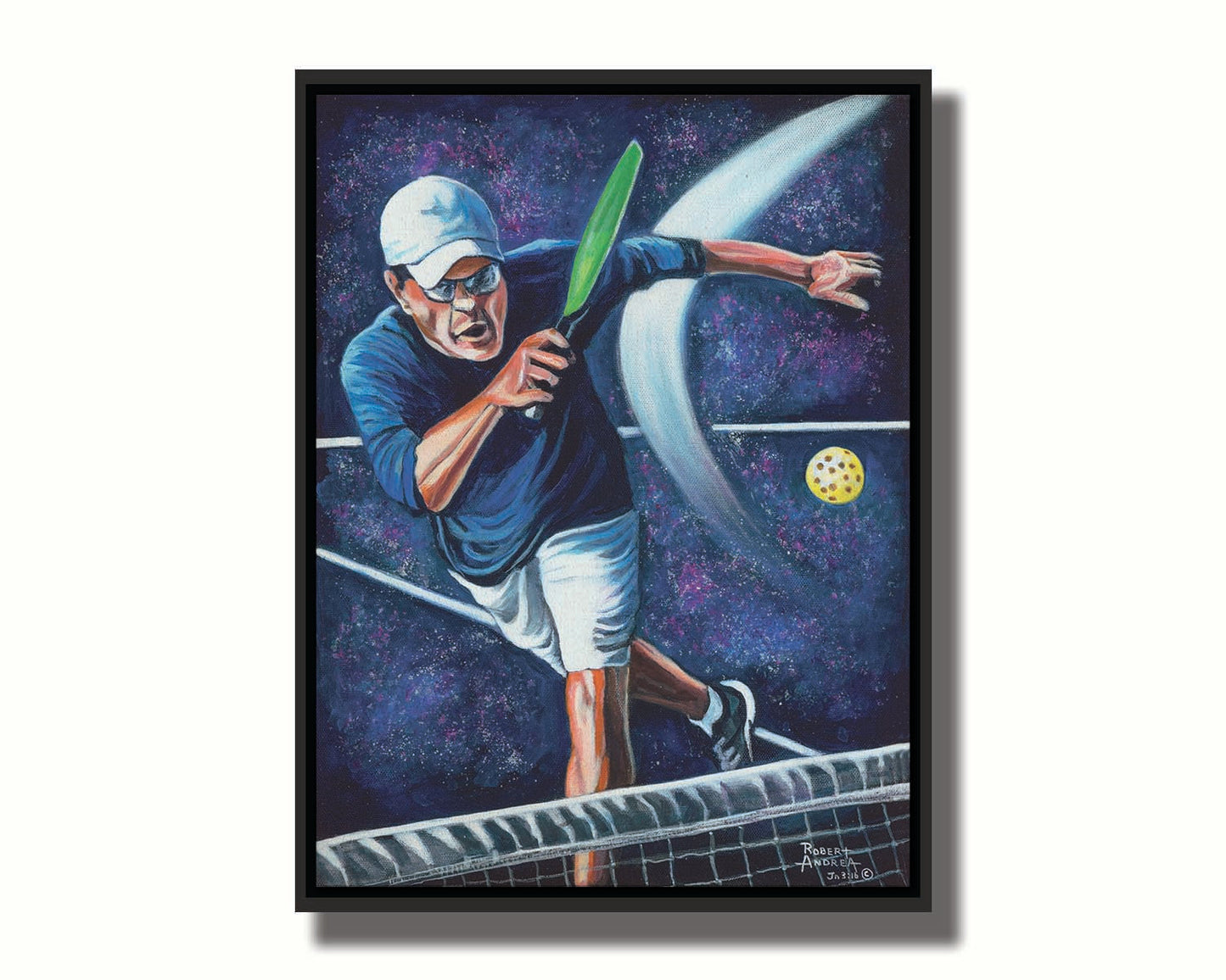 A painting of a man swinging a pickleball paddle, hitting the ball over the net. Printed on canvas in a float frame.