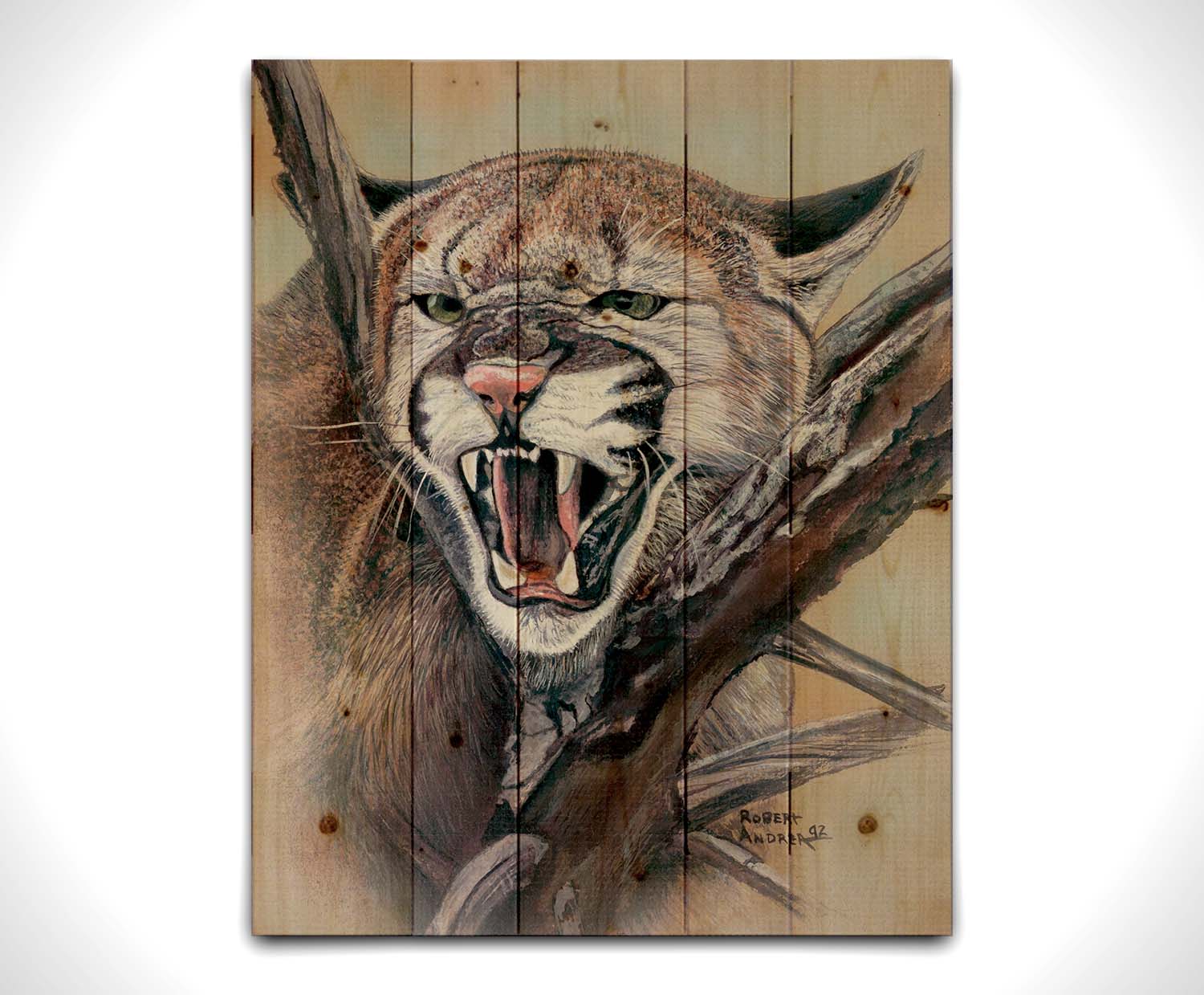 A painting of a snarling mountain lion peering through a tree. Printed on a wood pallet.