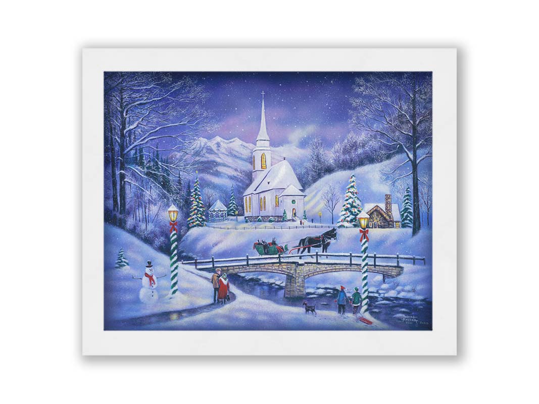 A painting of a snowy mountain town, decorated for Christmas. A tall church sits in the middle of town. A horse-drawn sleigh crosses a bridge over a freezing river. Printed on canvas and framed.