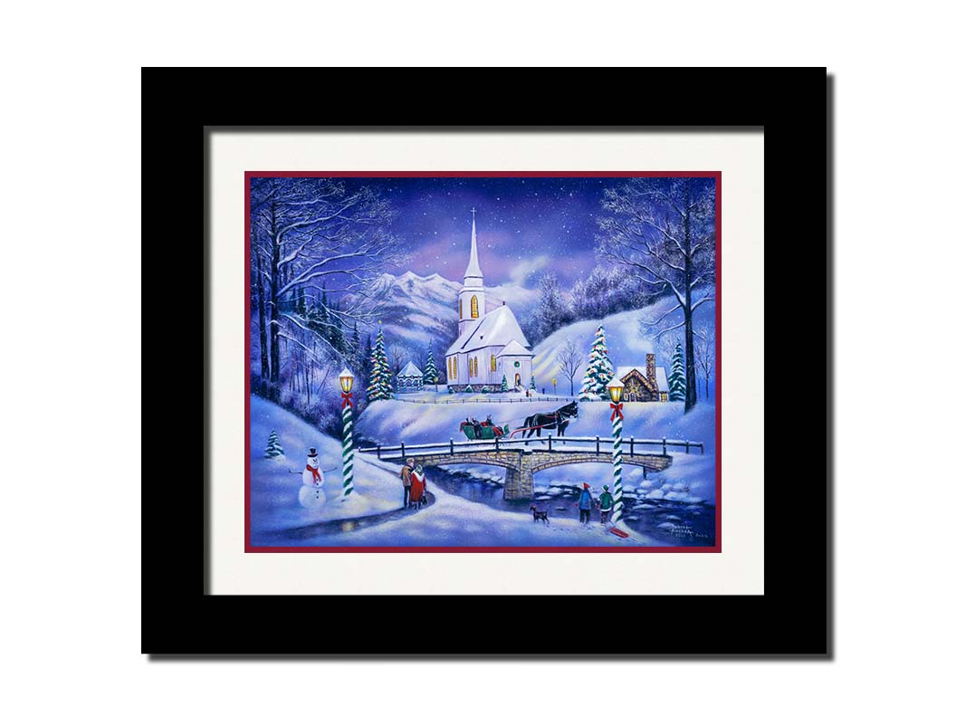 A painting of a snowy mountain town, decorated for Christmas. A tall church sits in the middle of town. A horse-drawn sleigh crosses a bridge over a freezing river. Printed on paper, matted, and framed.