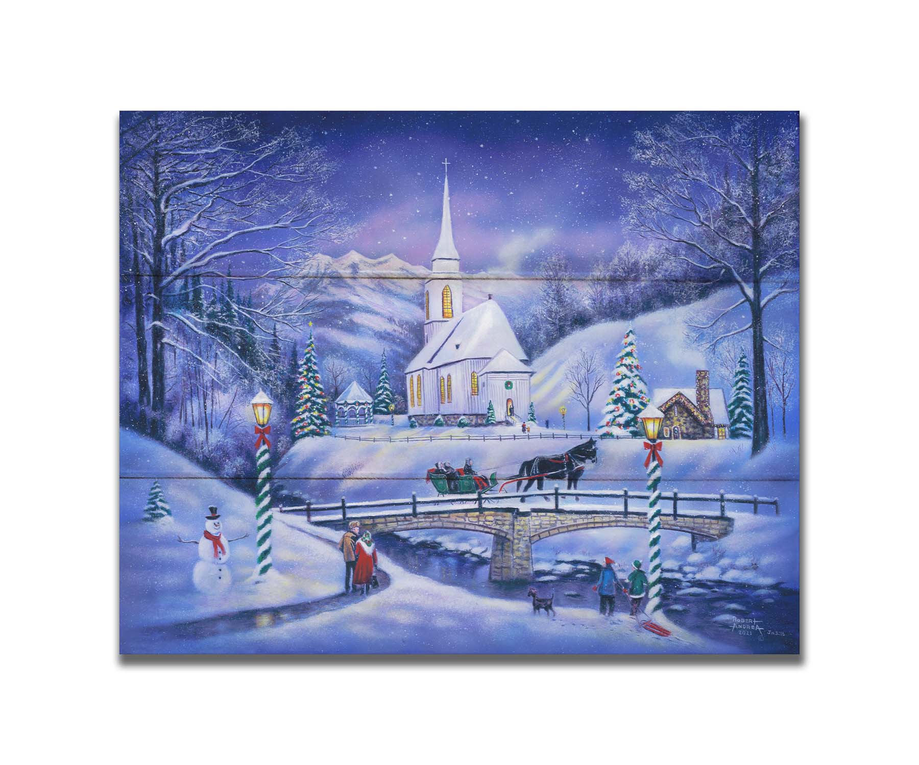 A painting of a snowy mountain town, decorated for Christmas. A tall church sits in the middle of town. A horse-drawn sleigh crosses a bridge over a freezing river. Printed on a box board.