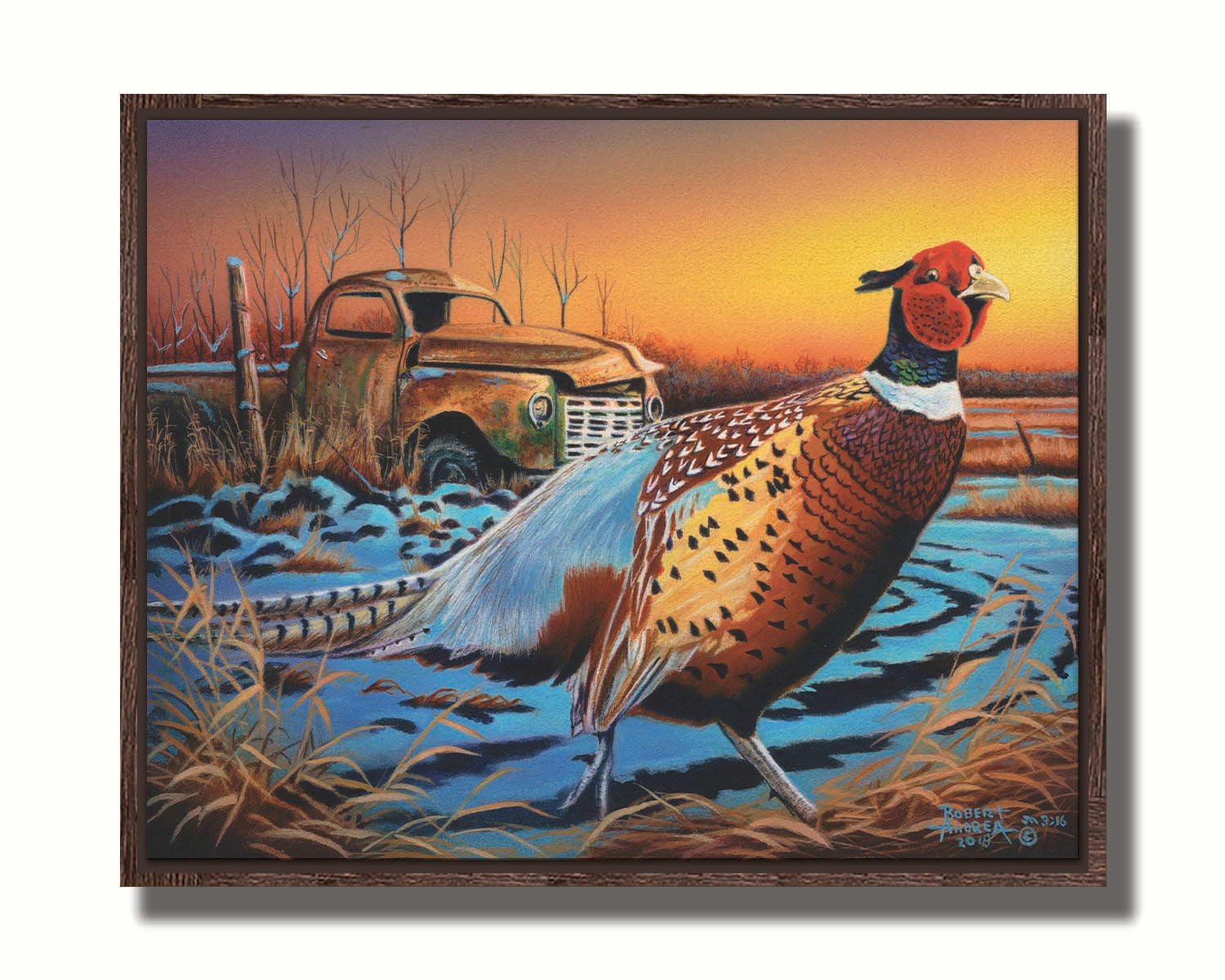 A painting of a pheasant trotting through a snowy field. In the background, an old green truck sits rusted. The sun is low in the sky, creating a soft orange atmosphere. Printed on canvas in a float frame.