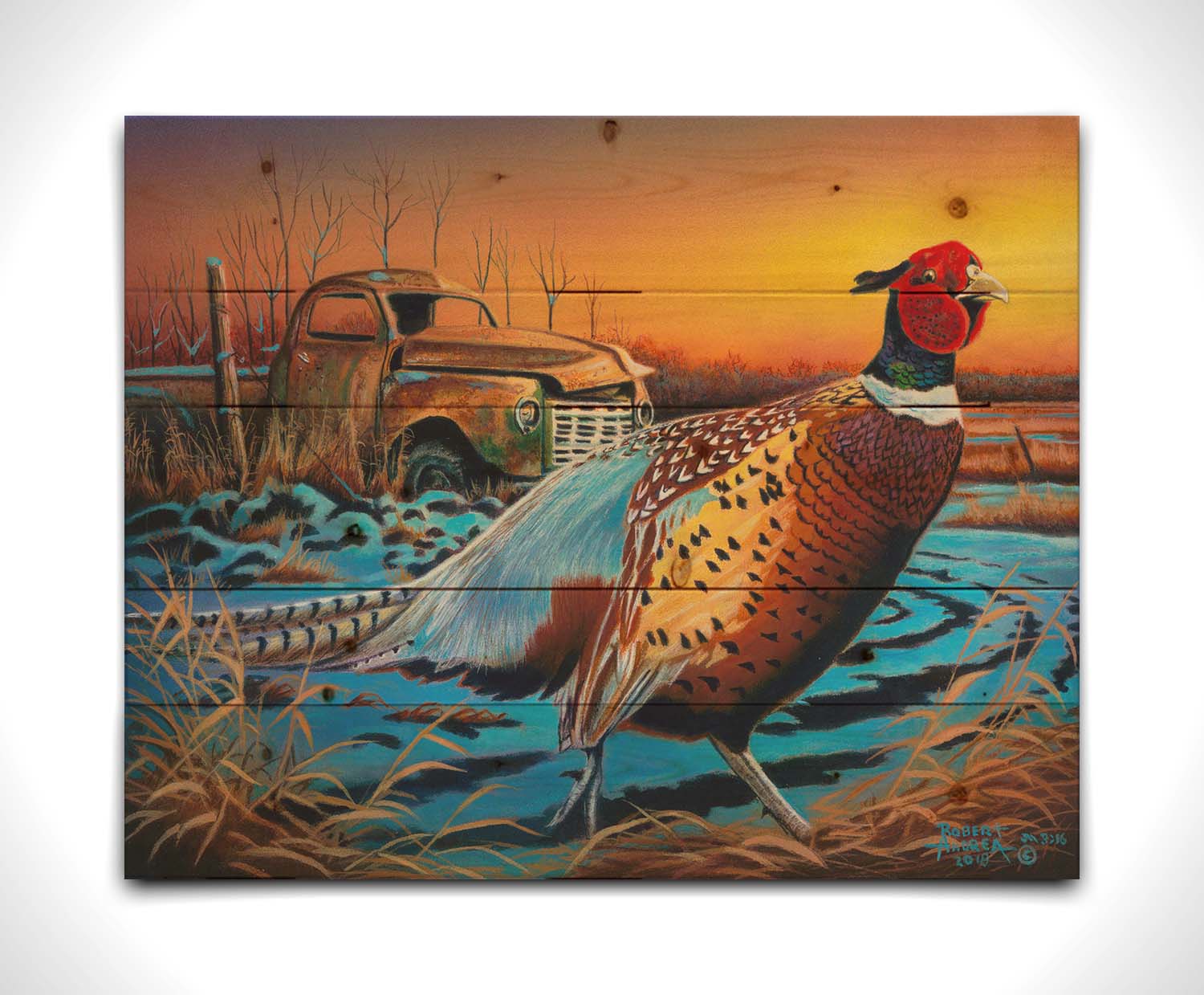 A painting of a pheasant trotting through a snowy field. In the background, an old green truck sits rusted. The sun is low in the sky, creating a soft orange atmosphere. Printed on a wood pallet.