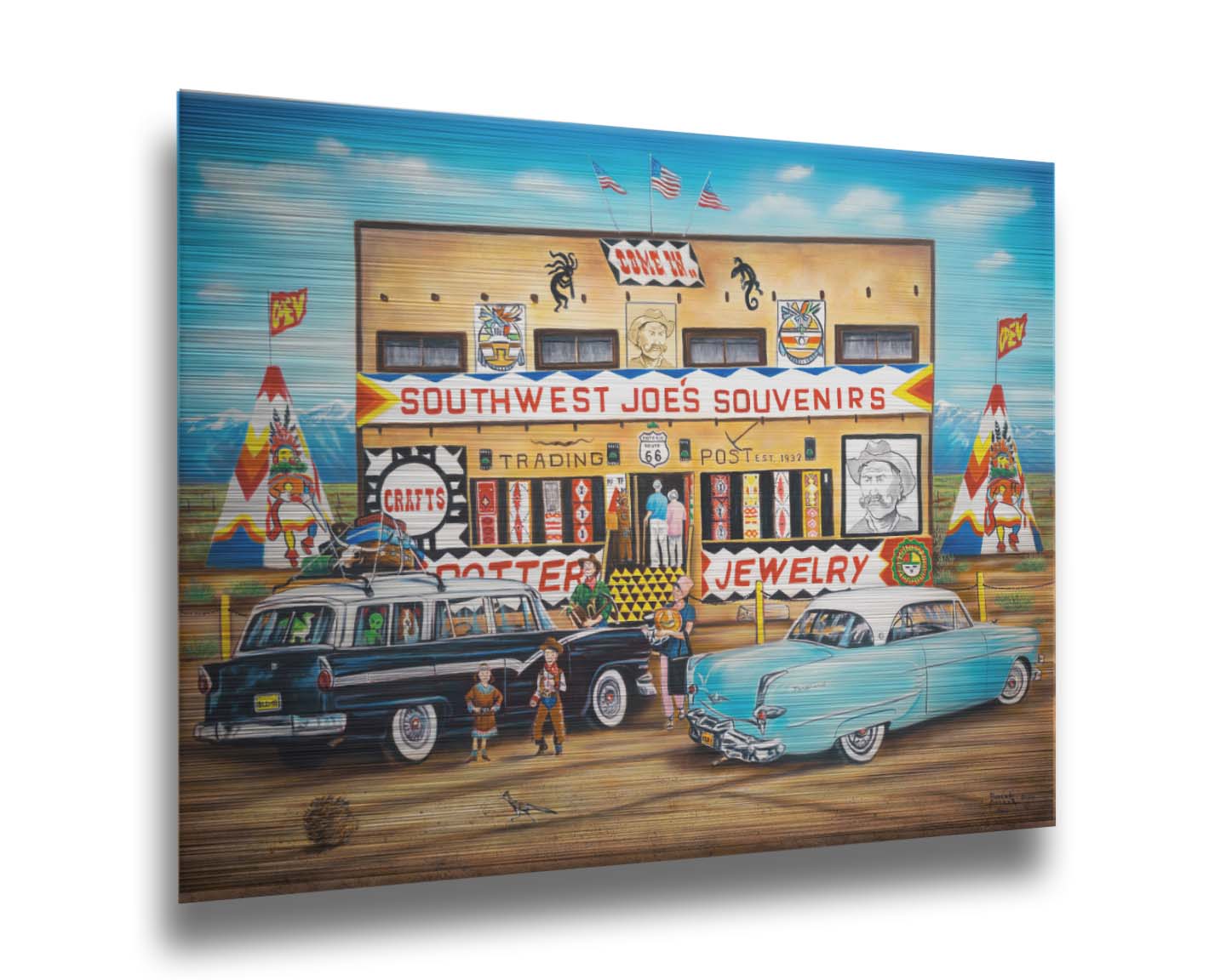 A painting of an American southwestern storefront. Several vintage cars packed for road trips are parked at the front of the souvenir shop. Printed on metal.