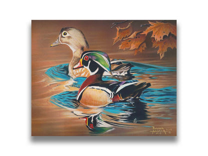 A painting of two wood ducks swimming through the water during fall. Their reflections are broken by the ripples of the water. Printed on canvas.