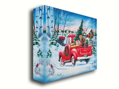 A painting of a little red pickup truck, carrying presents, a Christmas tree, and a family of puppies. It is drivng down a snowy path toward a cozy, inviting log cabin in the distance. Printed on canvas.