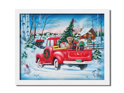 A painting of a little red pickup truck, carrying presents, a Christmas tree, and a family of puppies. It is drivng down a snowy path toward a cozy, inviting log cabin in the distance. Printed on canvas and framed.