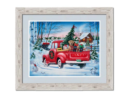 A painting of a little red pickup truck, carrying presents, a Christmas tree, and a family of puppies. It is drivng down a snowy path toward a cozy, inviting log cabin in the distance. Printed on paper, matted, and framed.