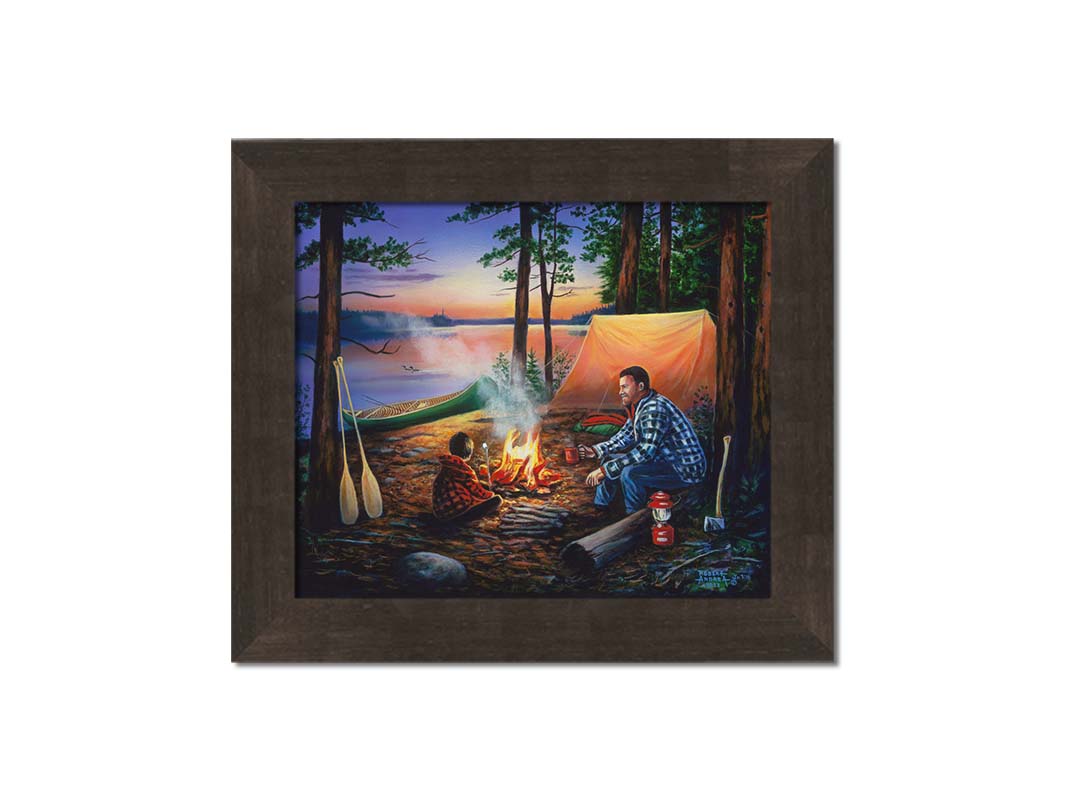 A painting of a father and son camping in the woods. The sun sets in the background over a lake, as the two sit at a campfire roasting marshmallows. Printed on canvas and framed.