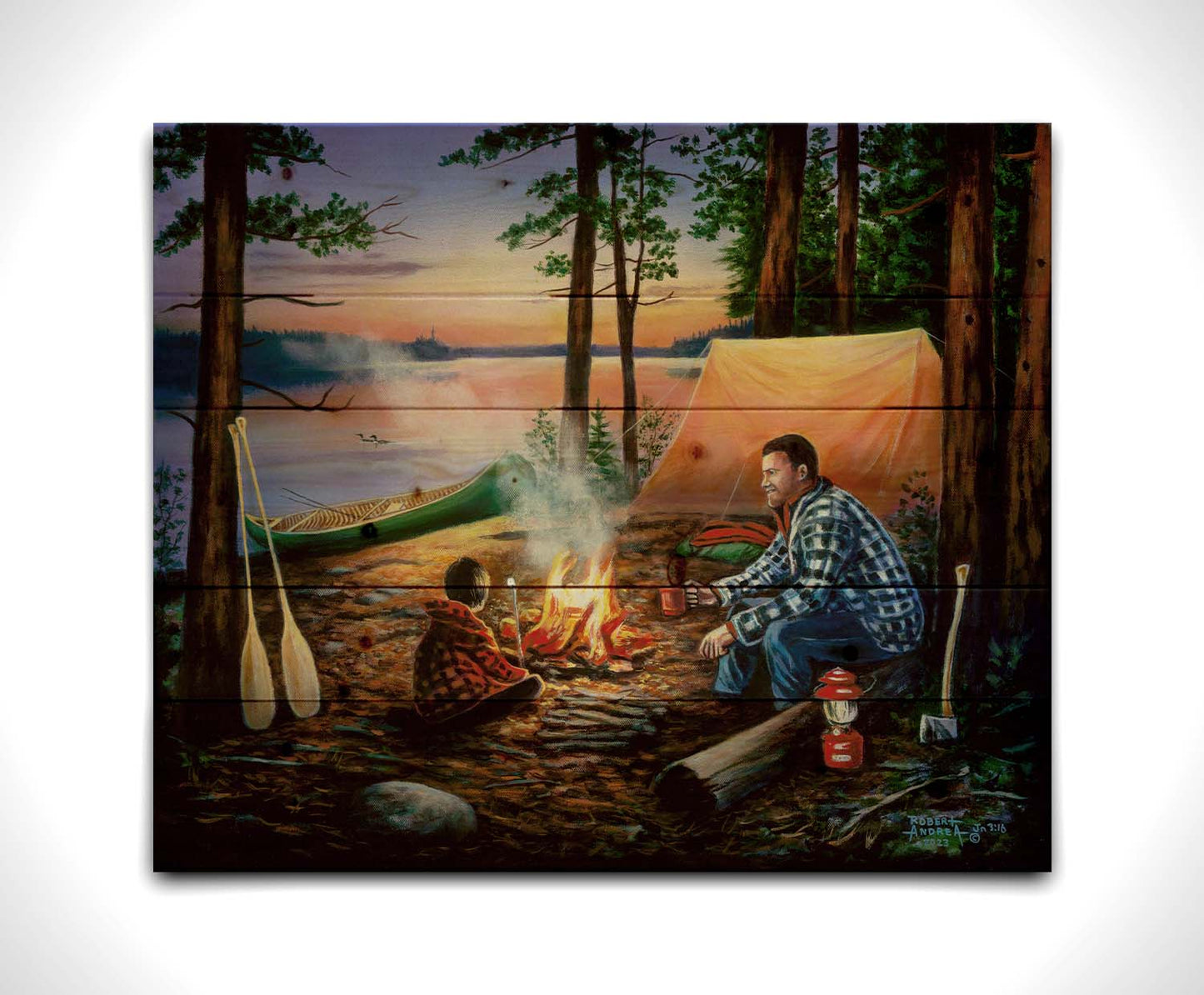 A painting of a father and son camping in the woods. The sun sets in the background over a lake, as the two sit at a campfire roasting marshmallows. Printed on a wood pallet.