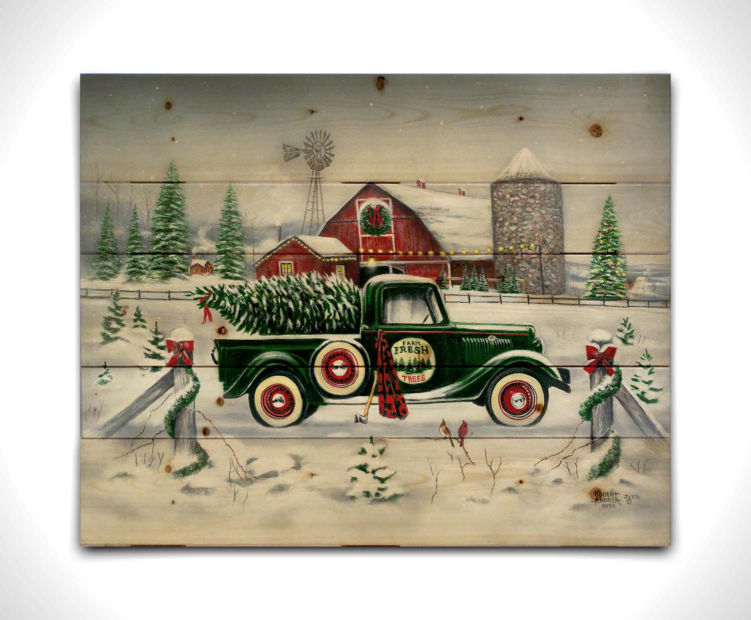 A painting of a green truck on a snowy road, preparing to deliver a freshly cut evergreen tree to a customer. A big red barn sits in the background, surrounded by large evergreens decorated for Christmas. Printed on a wood pallet.