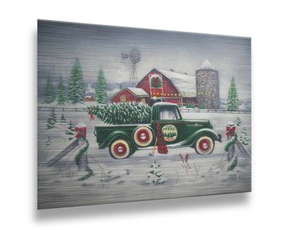 A painting of a green truck on a snowy road, preparing to deliver a freshly cut evergreen tree to a customer. A big red barn sits in the background, surrounded by large evergreens decorated for Christmas. Printed on metal.