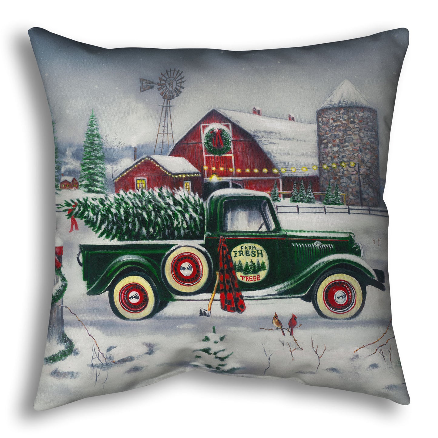 Decorative pillow with a vintage truck and Christmas tree design.